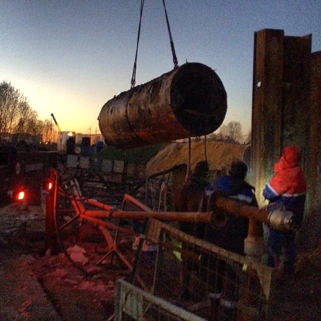 A tunnelling complex being lifted from an underground construction site after a recovery operation in Russia.